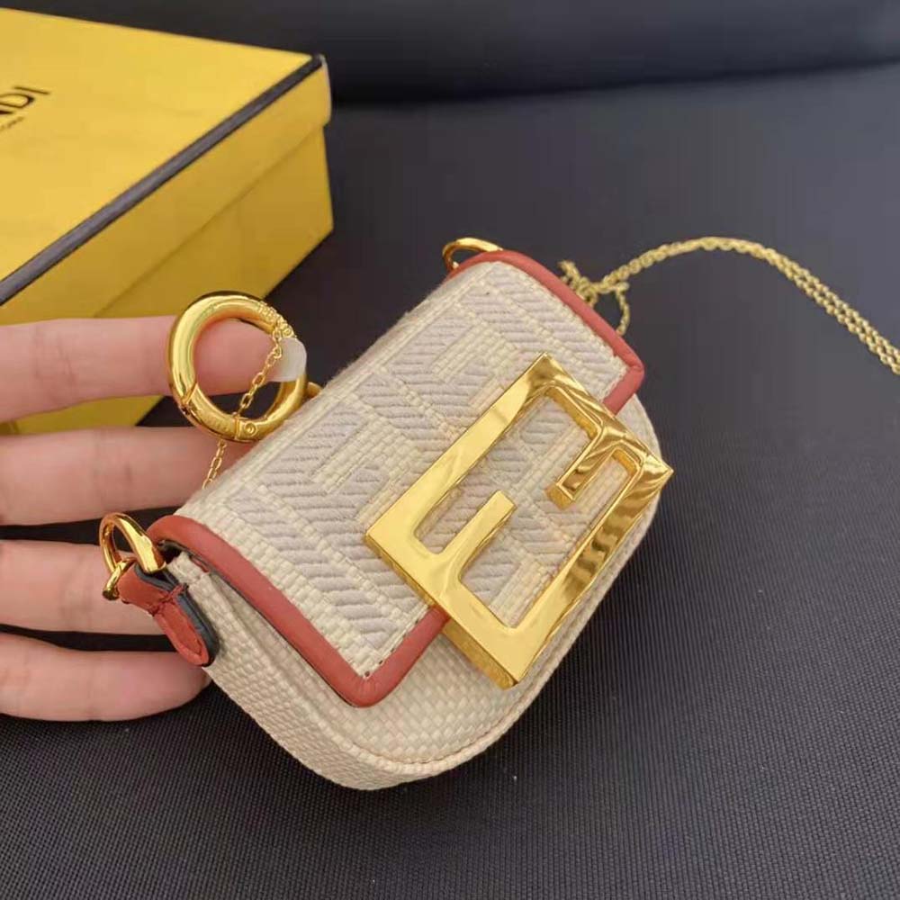 Side angle showing raffia texture on Fendi Women Nano Baguette Charm