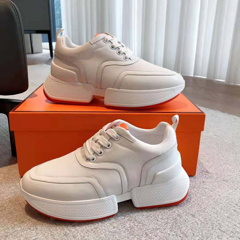 Close-up on white calfskin leather and stitched mesh detail of Hermes Unisex Giga Sneaker