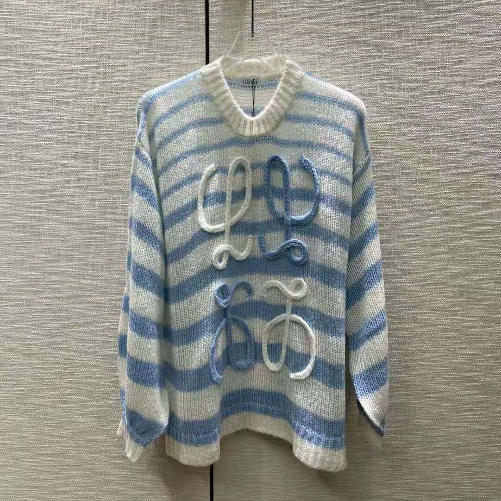 Close-up of embroidered Loewe Anagram on blue mohair sweater