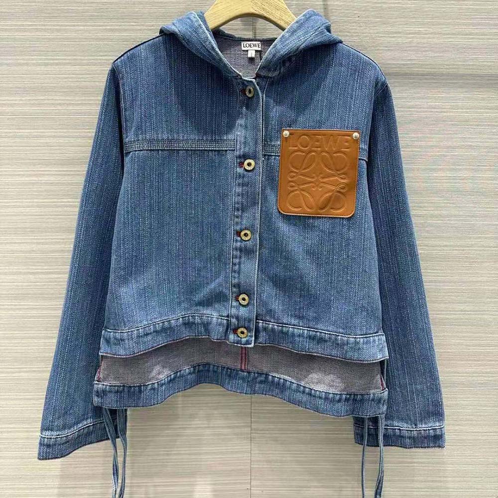 Close-up of button closure and branded metal hardware on Loewe denim jacket