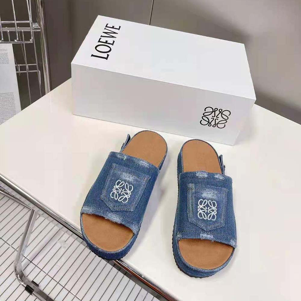 Close-up of raw-edged denim and embossed logo on Loewe Women Deconstructed Slide