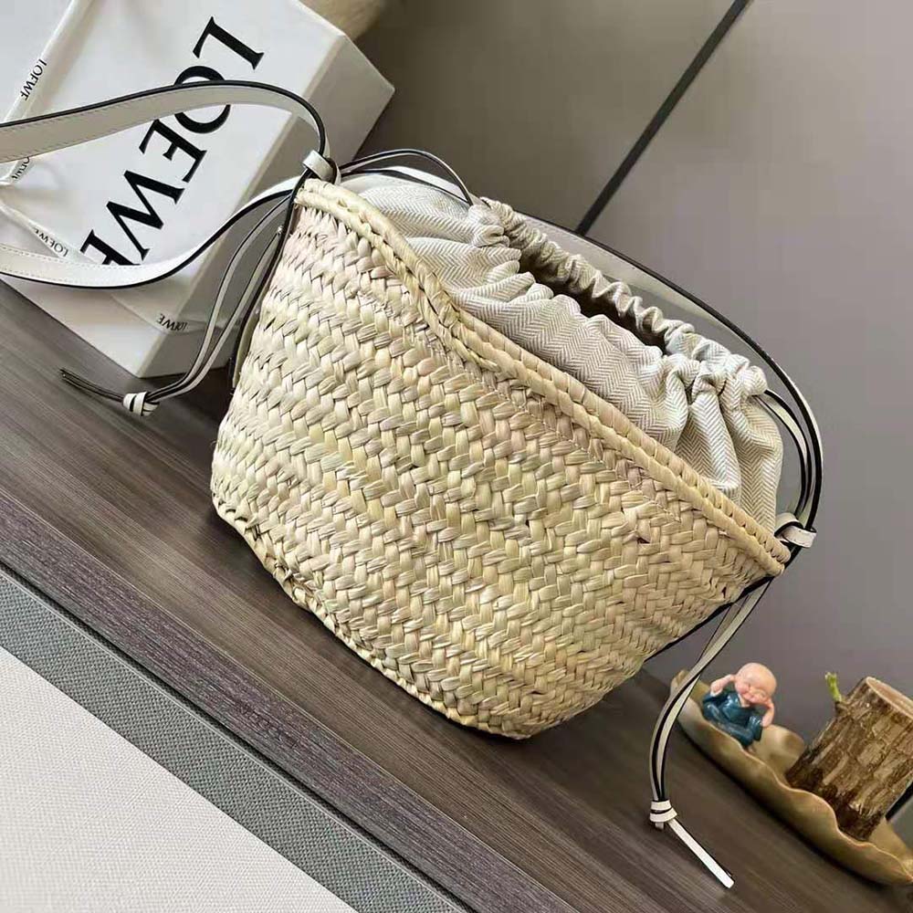 Side angle showing drawstring closure on Loewe Women Drawstring Bucket Bag