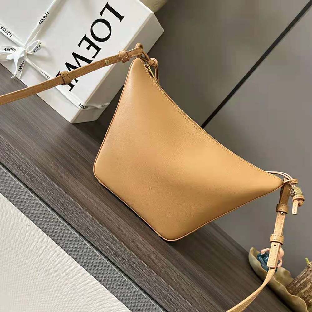Side profile showing slouchy silhouette of Loewe Mini Hammock Hobo Bag
