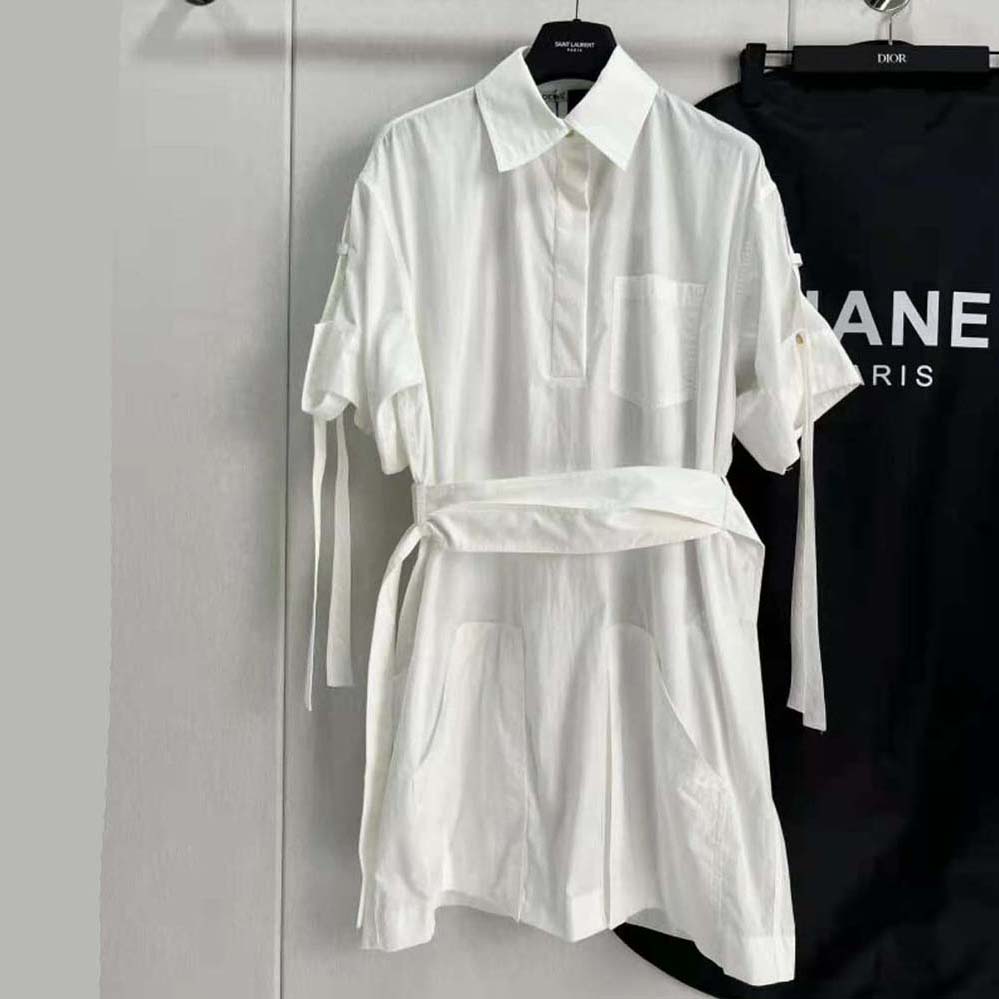Close-up of signature Loewe logo buttons on mini dress