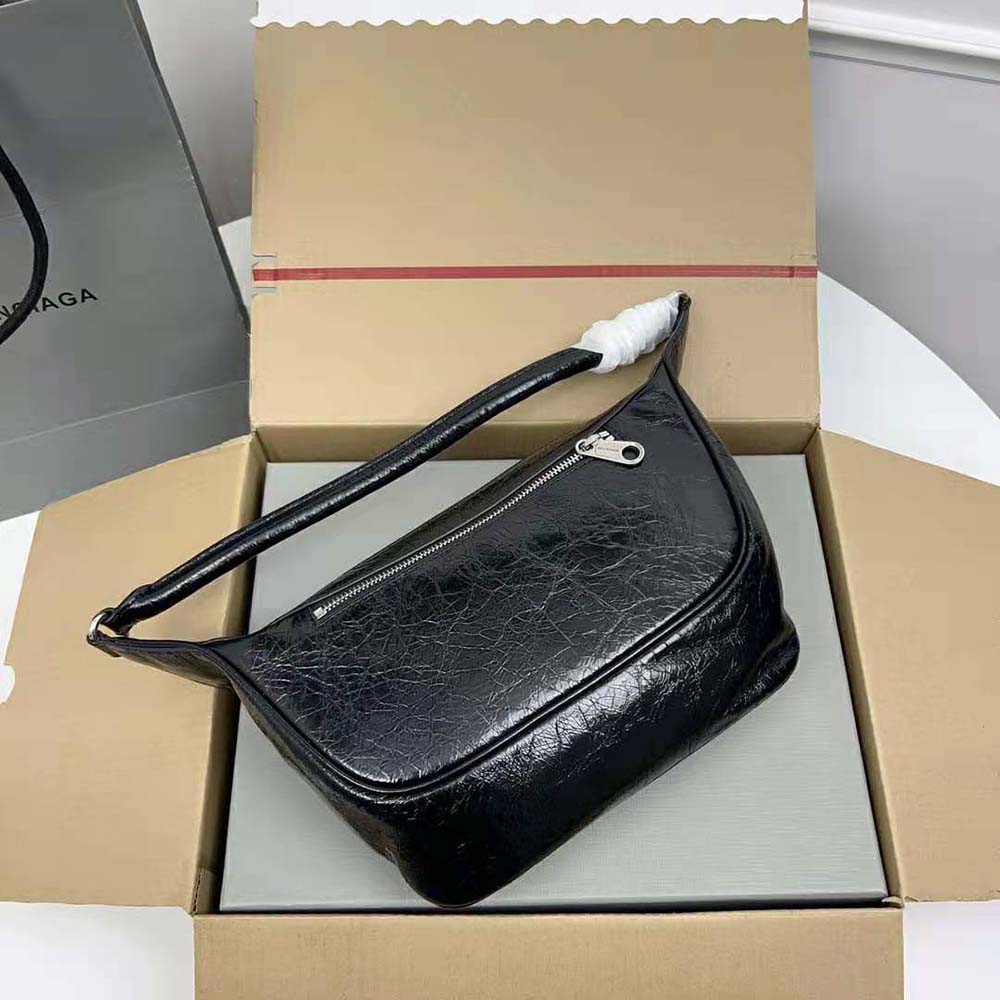 Side angle showing the structured silhouette of Balenciaga Women Raver Medium Bag