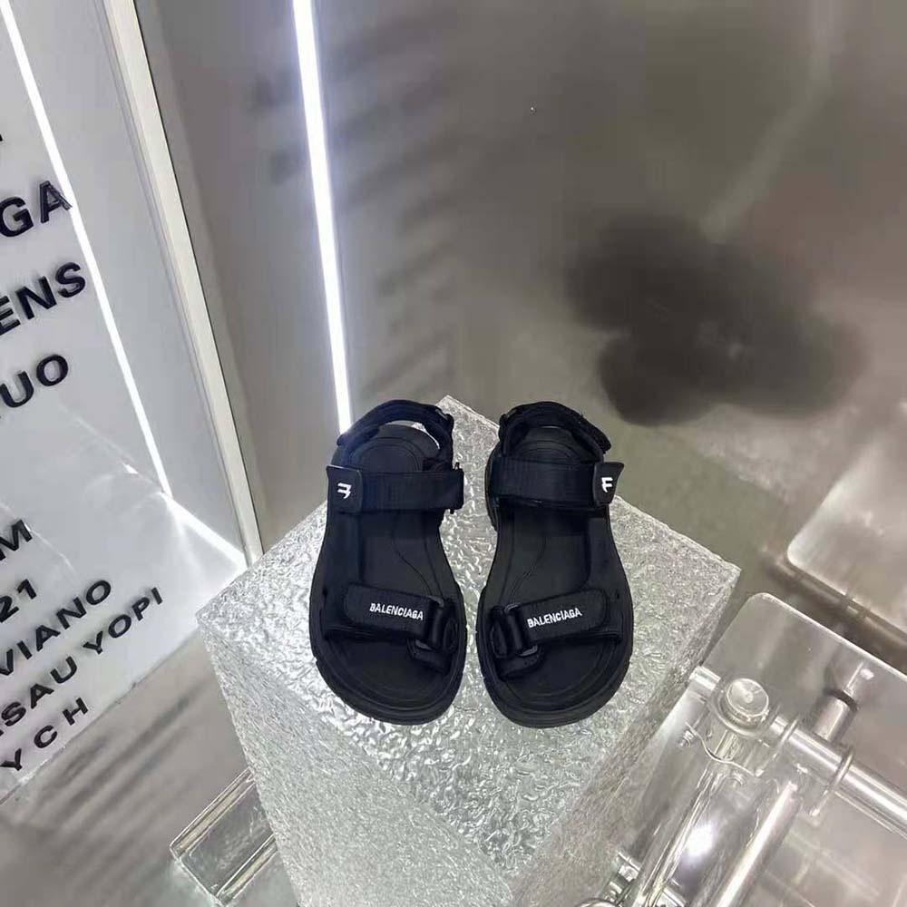 Close-up of black technical fabric and Velcro strap on Balenciaga sandal