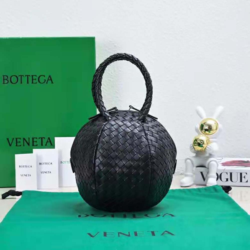 Close-up of gold-tone hardware and zipper on Bottega Veneta Women Mava Top Handle Bag-Black