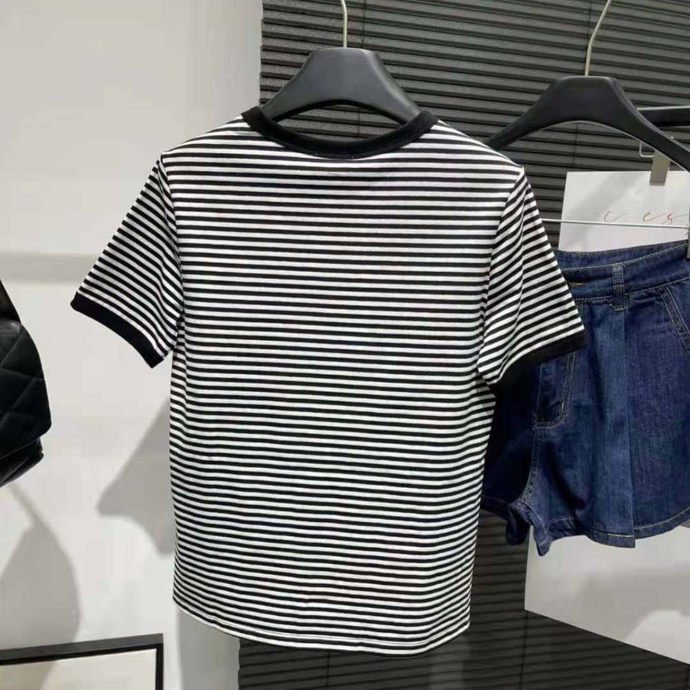 Side angle showing relaxed fit of Celine Women 70’s Anchor T-shirt