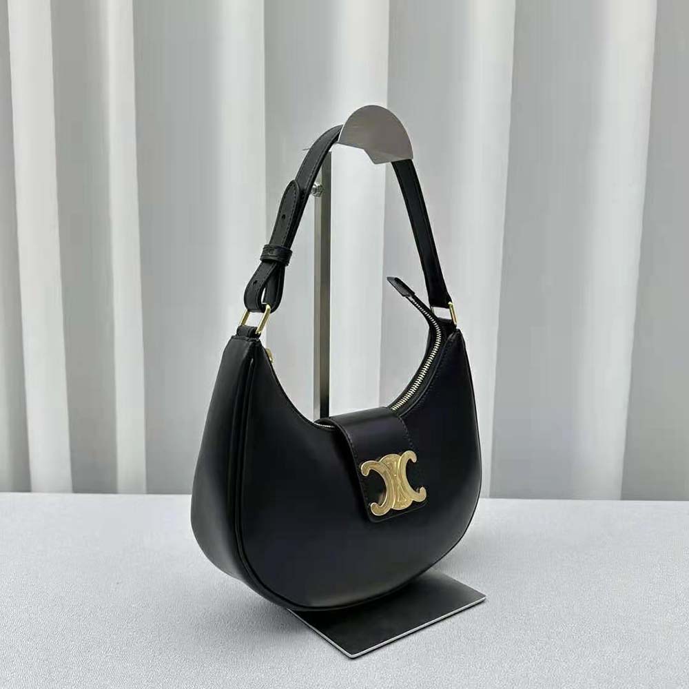 Side angle showing soft silhouette of Celine Women Ava Triomphe Soft Bag