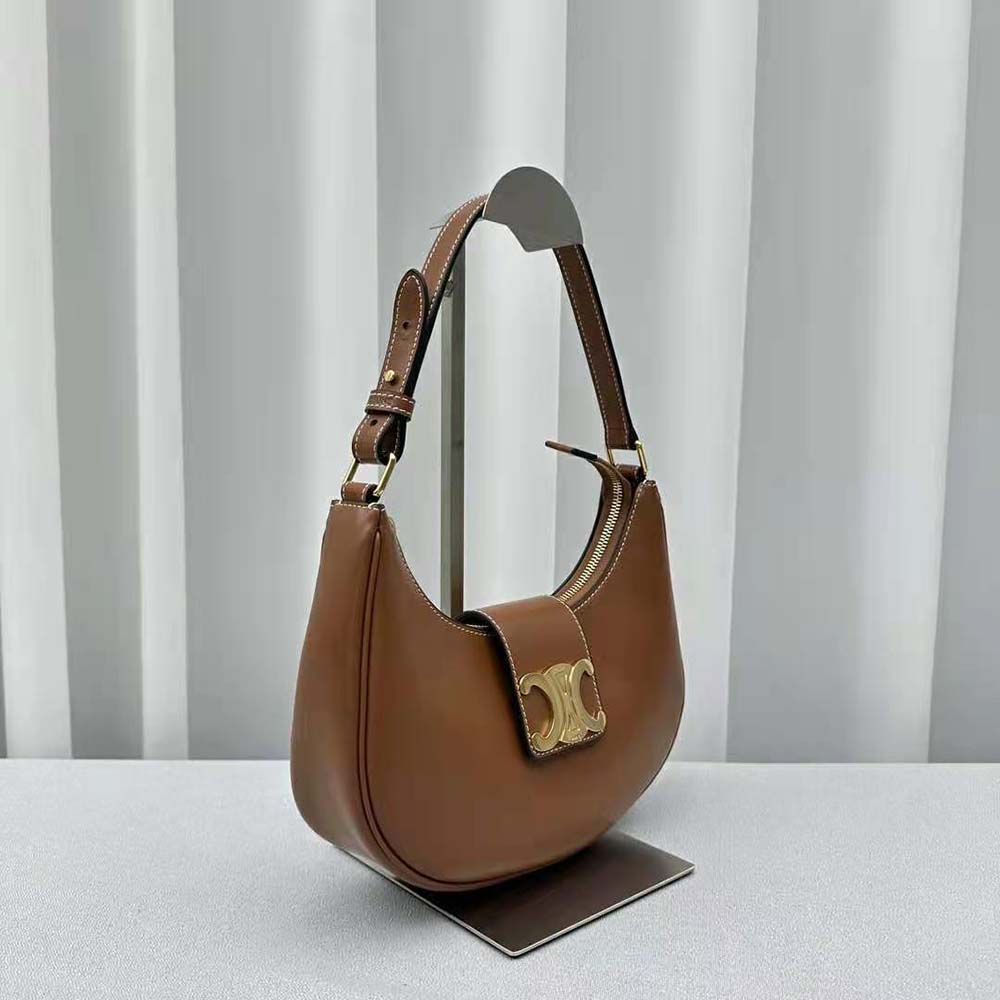 Close-up of gold Triomphe clasp on Celine Ava Soft Bag brown leather