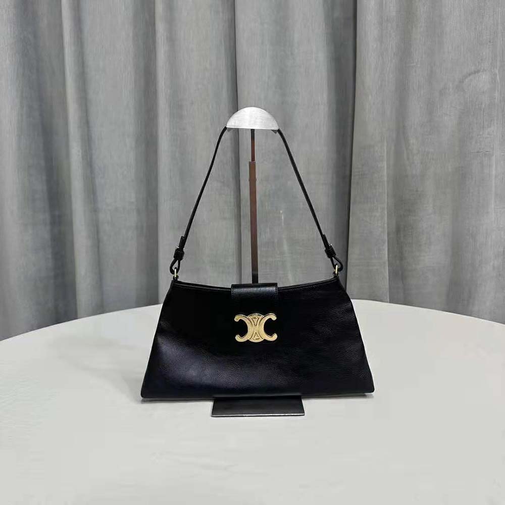 Close-up of gold Triomphe clasp on Celine Wiltern Clutch Black