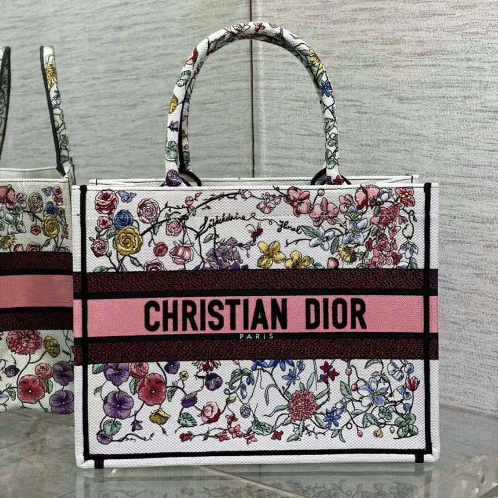 Close-up of vibrant Florilegio embroidery on Dior Women Medium Dior Book Tote white canvas