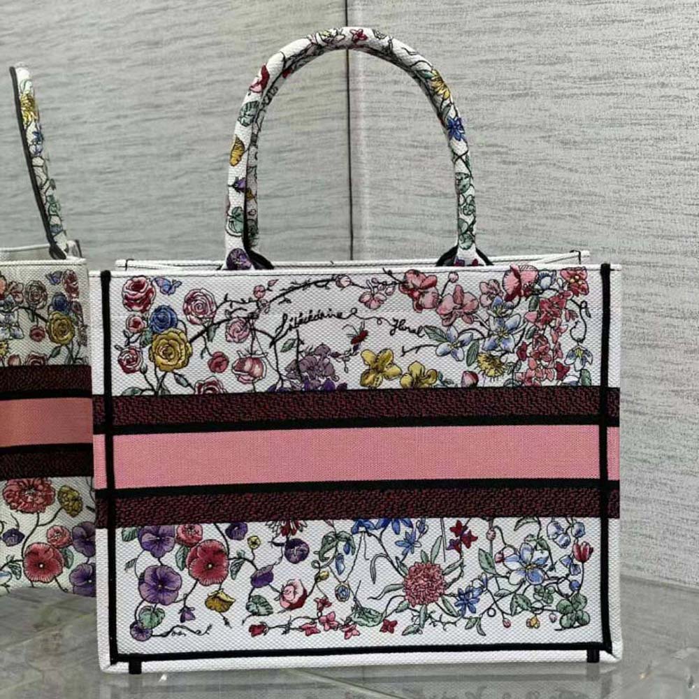 Side angle showing silver hardware and structured shape of Dior Women Medium Dior Book Tote