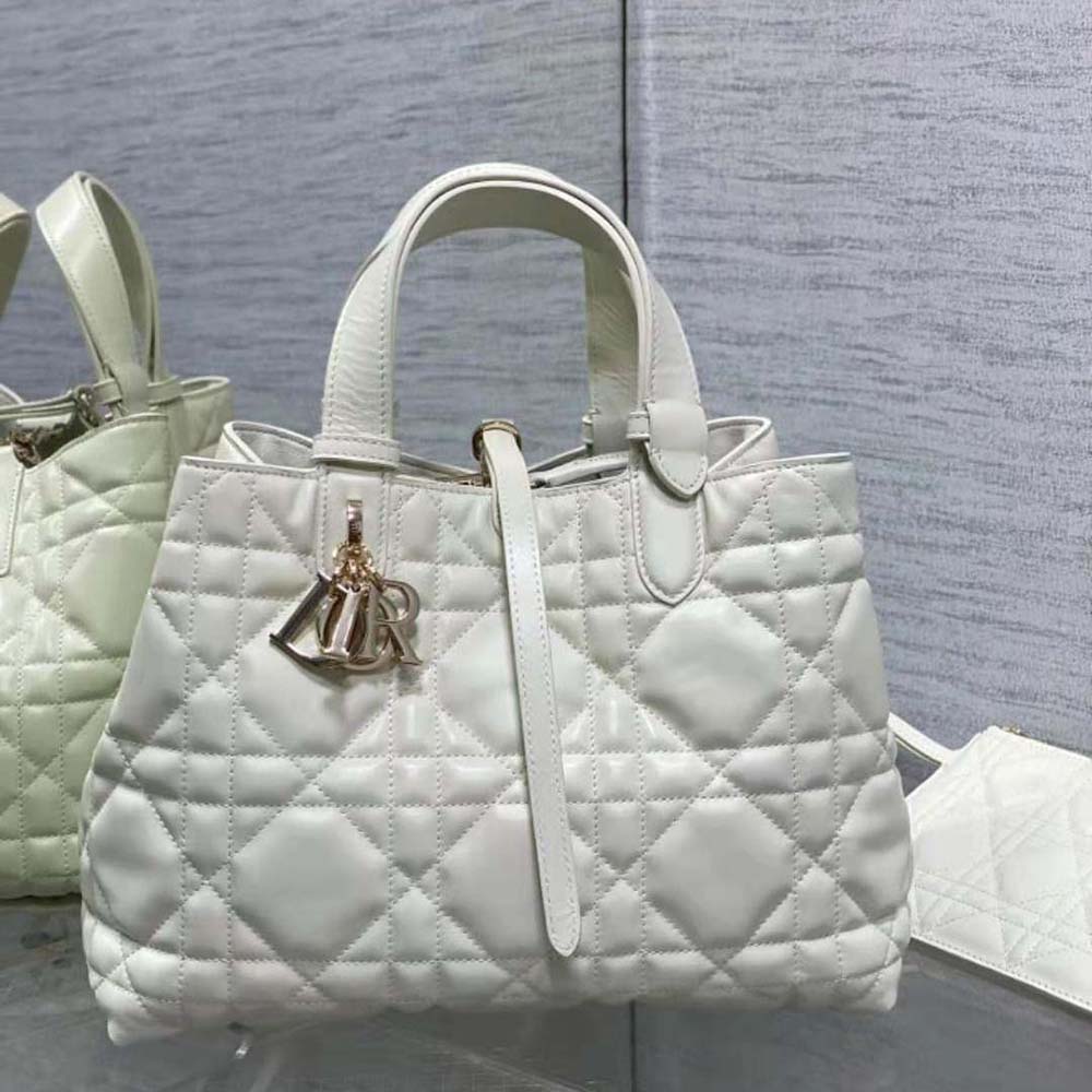 Side profile showing adjustable strap on Dior Women Medium Dior Toujours Bag