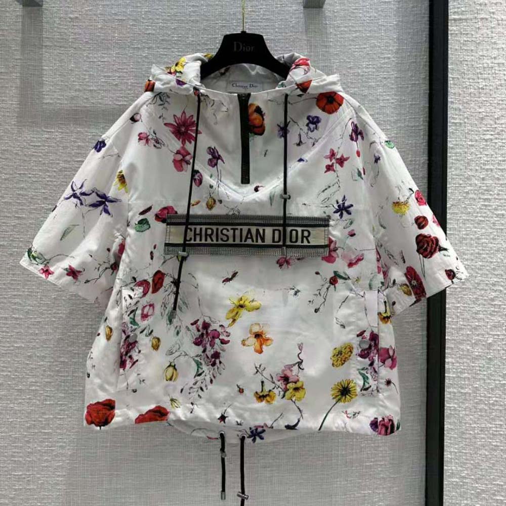 Close-up of signature Dior zipper hardware on short anorak hood