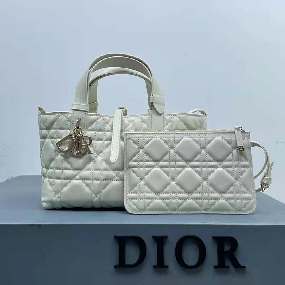 Close-up of silver-tone CD clasp on Small Dior Toujours Bag in Latte Macrocannage