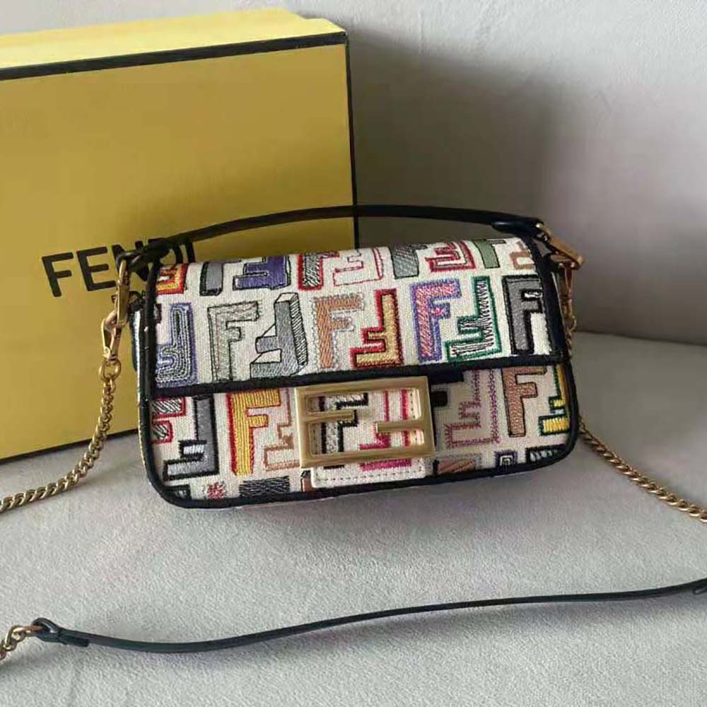 Close-up of gold hardware and embroidery on Fendi Women Baguette Mini bag