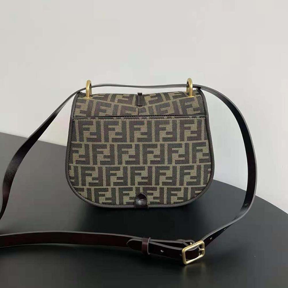 Side angle showing smooth leather strap of Fendi Women C’mon Medium Brown bag