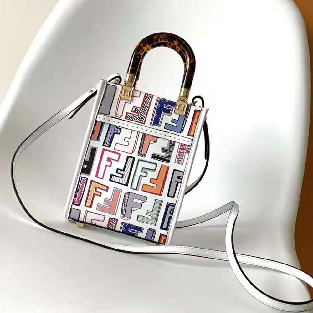 Side view showing white leather texture of Fendi Women Mini Sunshine Shopper mini-bag