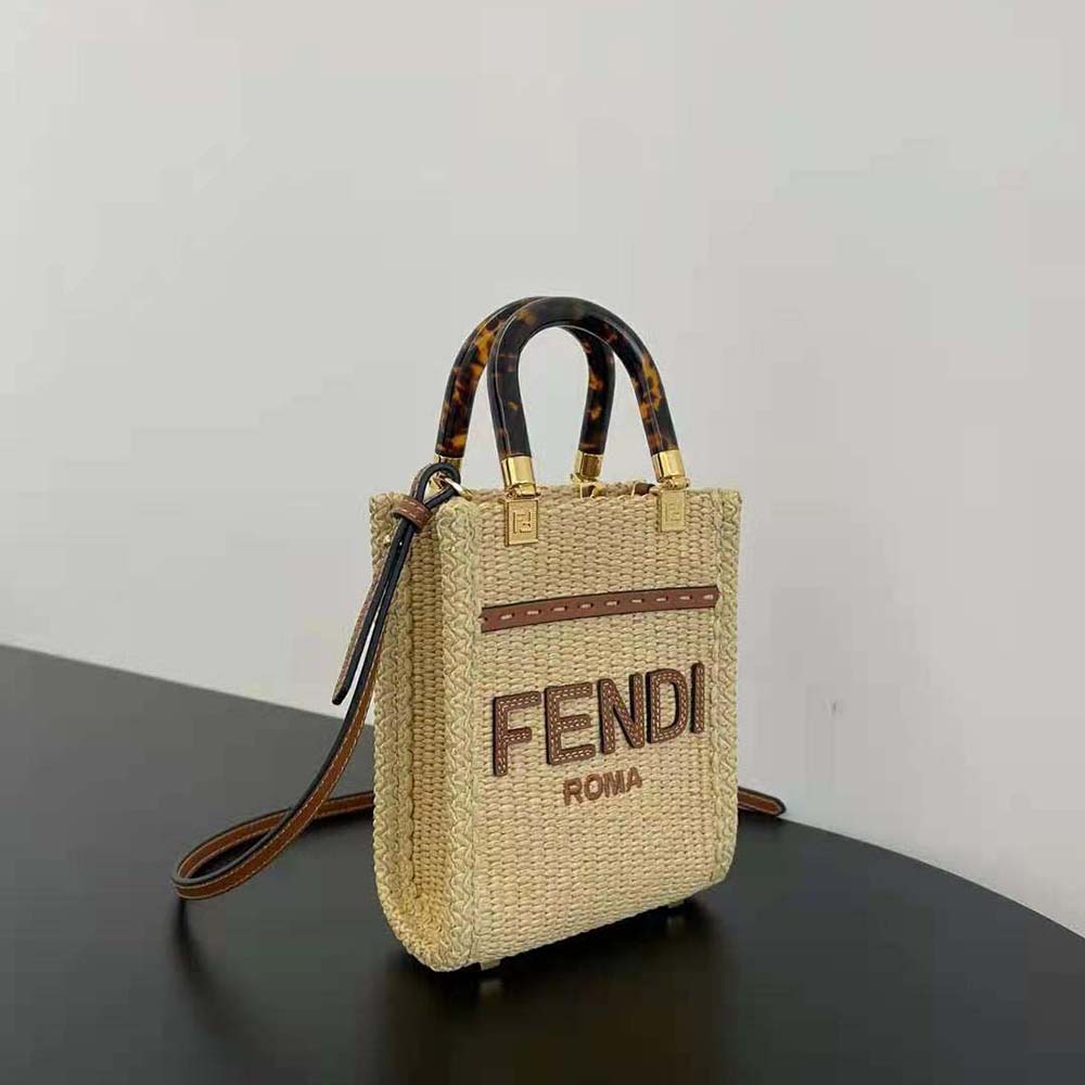 Side angle showing adjustable strap on Fendi Women Mini Sunshine Shopper