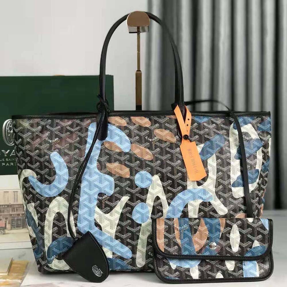 Close-up of blue camouflage coated canvas and gold hardware details