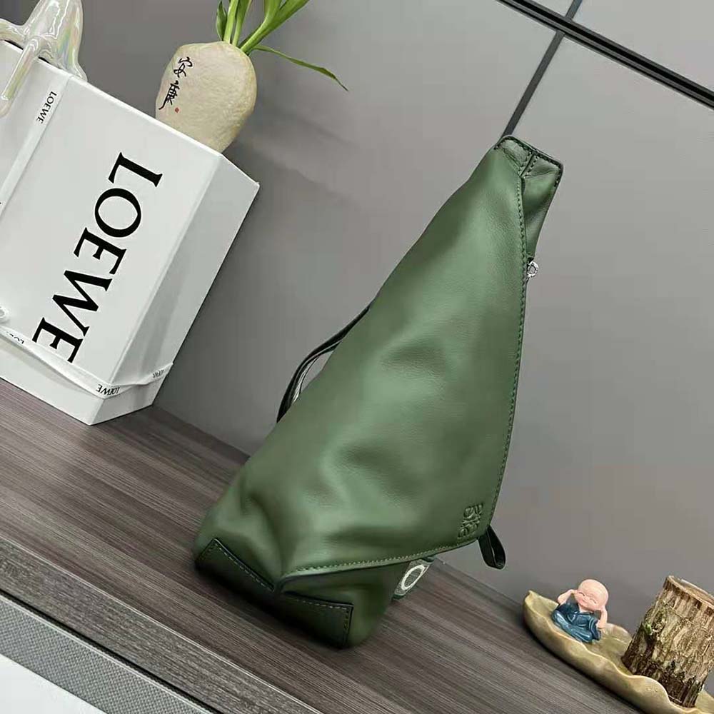 Side profile showing adjustable strap on Loewe Men Anton Sling green bag