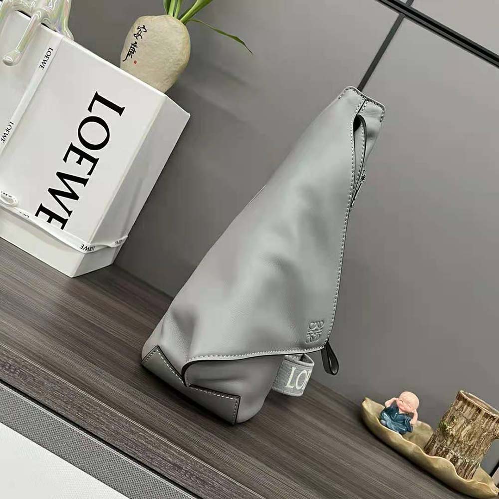 Side angle showing adjustable strap of Loewe Men Anton Sling gray bag