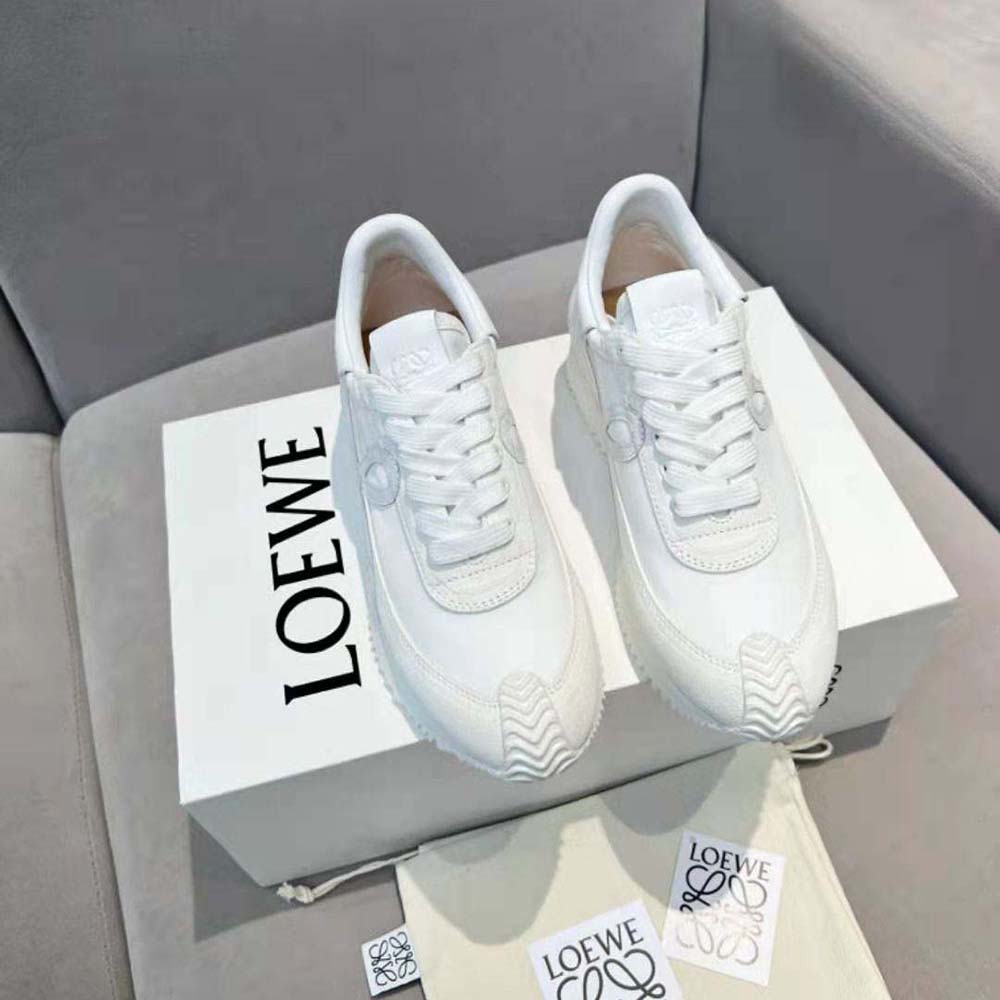 Close-up detail of white calfskin leather and Loewe logo embossing