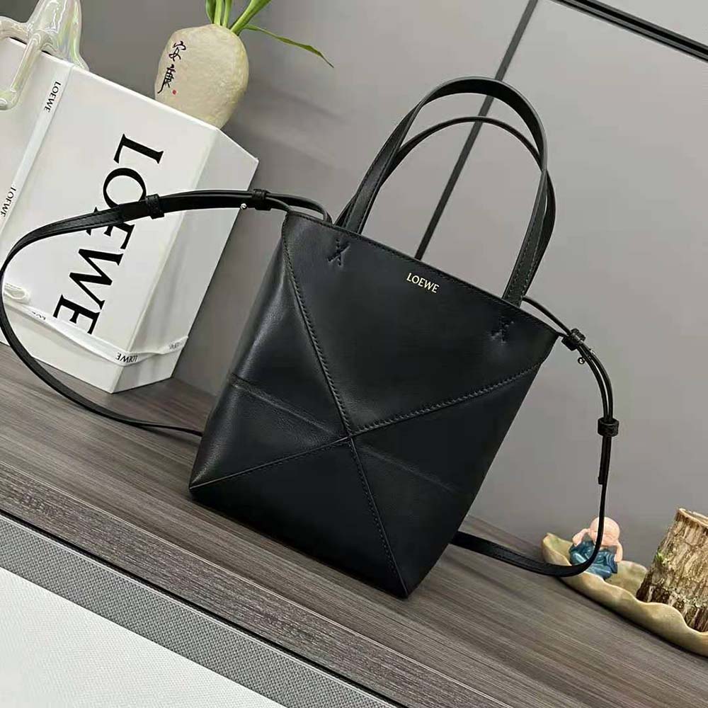 Close-up detail of gold hardware on Loewe Unisex Mini Puzzle Fold Tote black bag