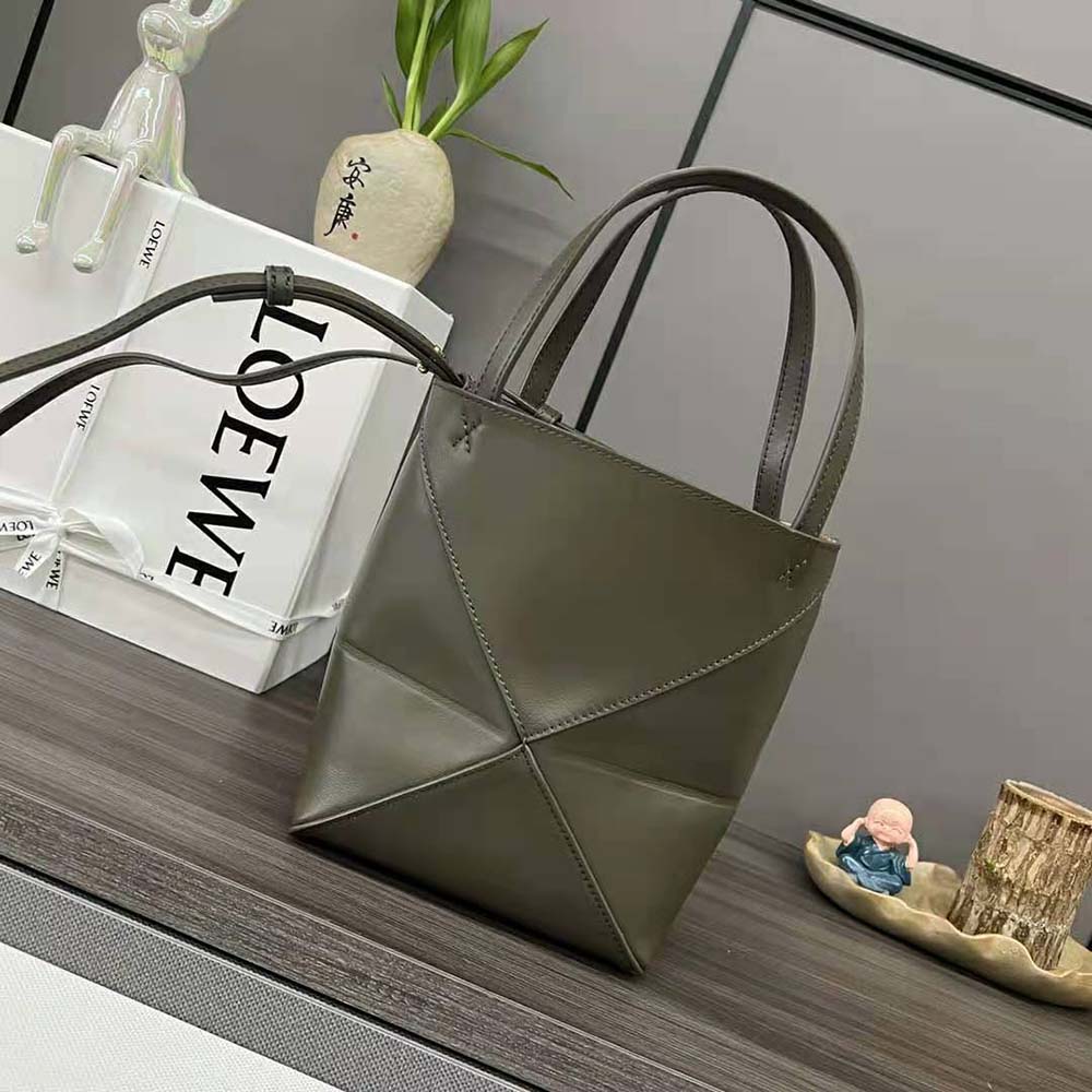 Close-up of silver-tone hardware on Loewe Mini Puzzle Fold Tote green leather