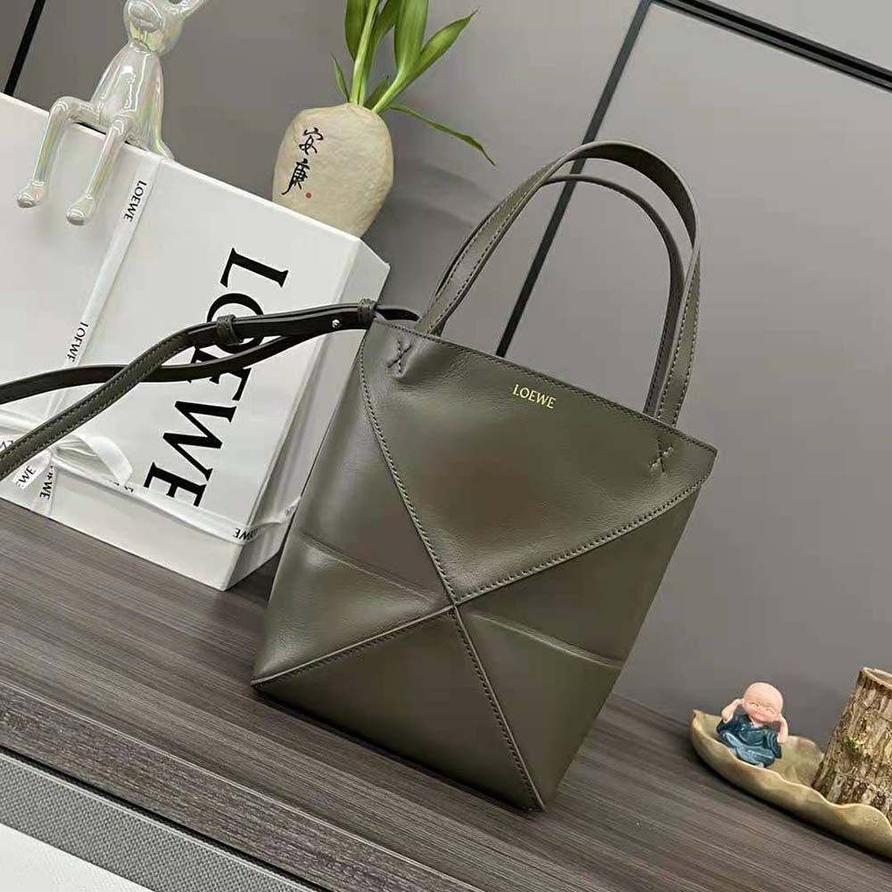 Side profile showing geometric fold design of Loewe Unisex Mini Puzzle Fold Tote