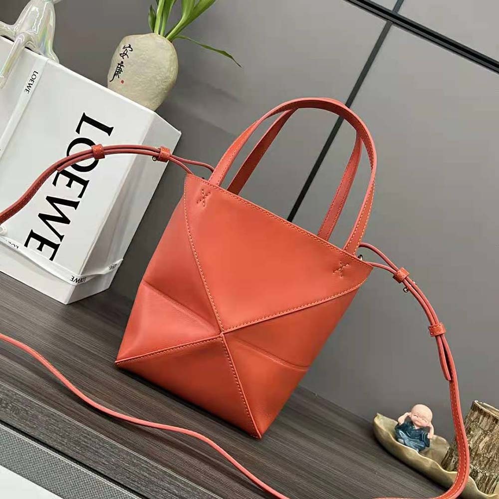 Side angle showing compact silhouette of Loewe Mini Puzzle Fold Tote