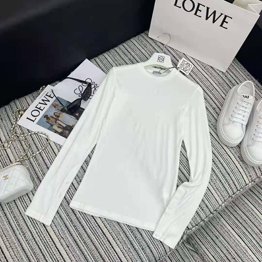 Close-up of Loewe logo detail on cuff of long sleeve top