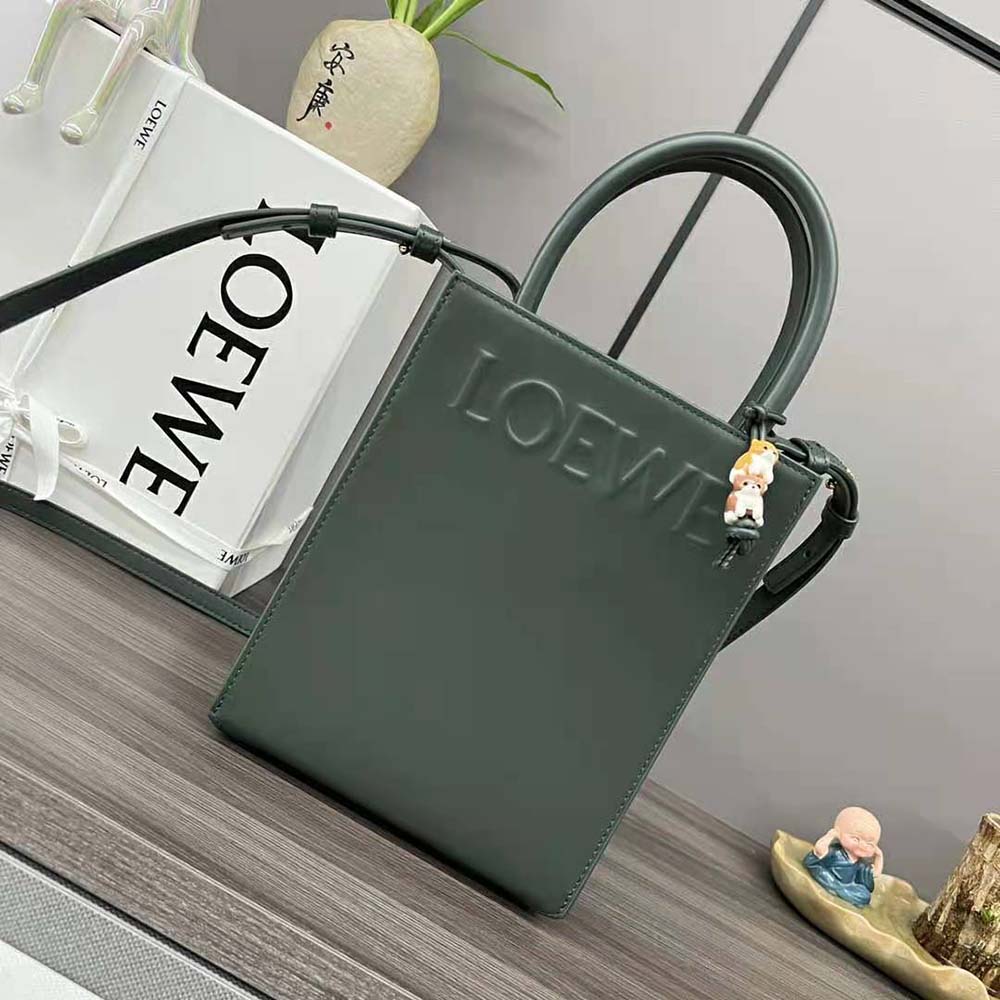 Close-up of green calfskin leather and silver hardware on Loewe tote