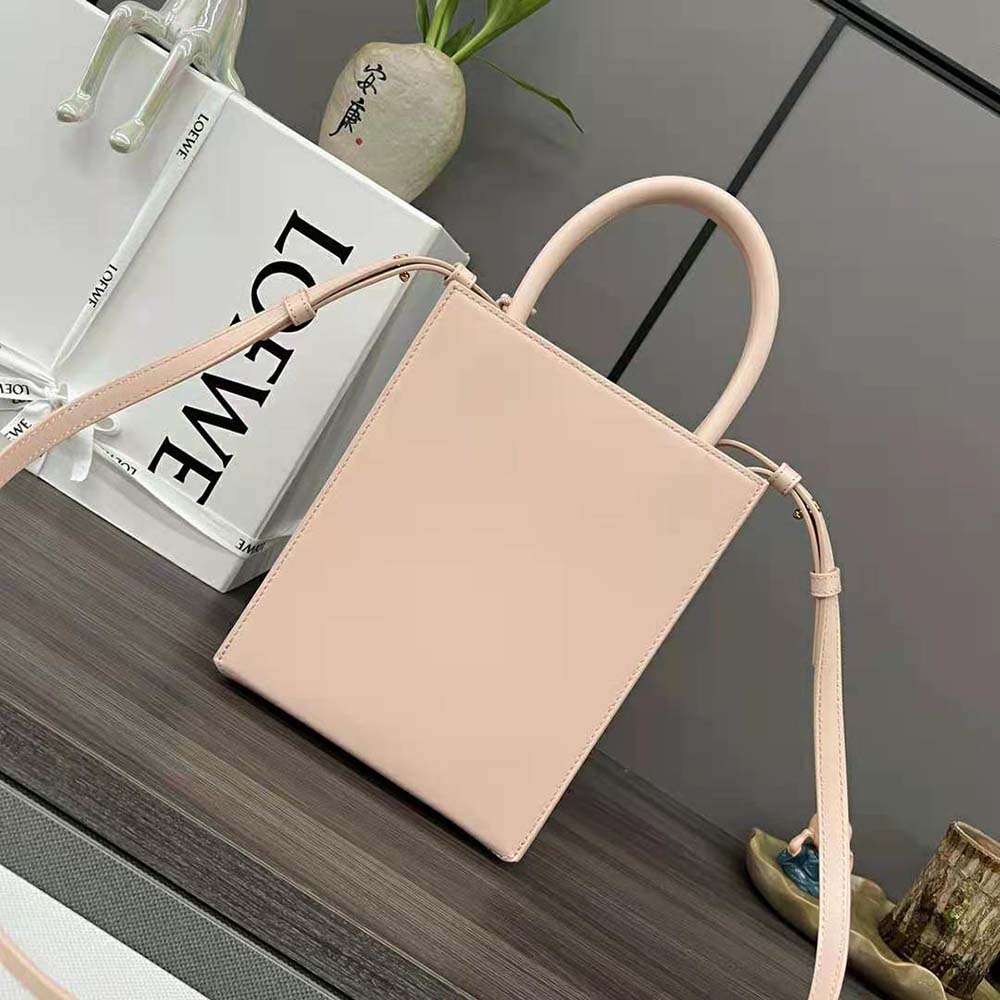 Side angle showcasing structured silhouette of Loewe Women Standard A5 Tote aqua