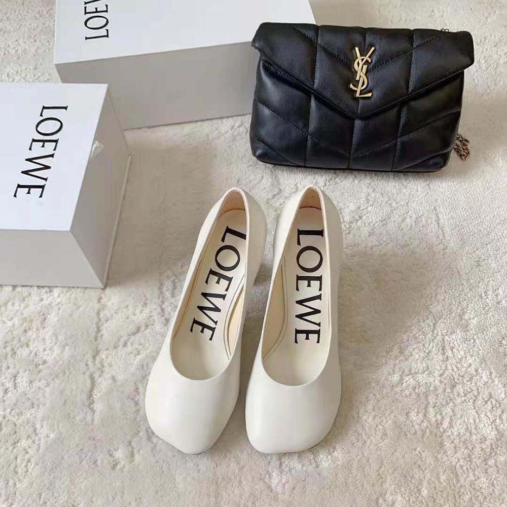 Close-up of embossed Loewe logo on white goatskin Toy Pump