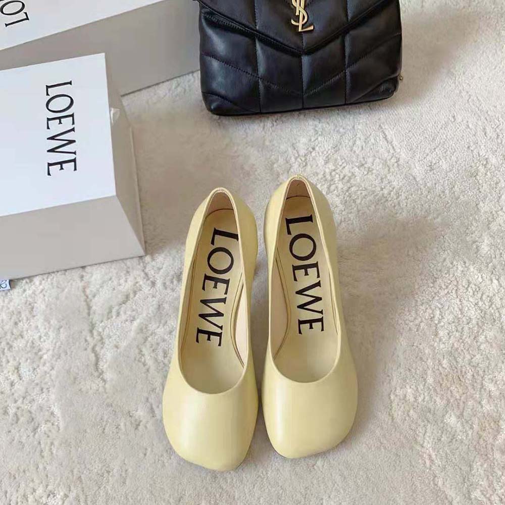 Close-up on embossed Loewe detail on yellow goatskin Toy Pump