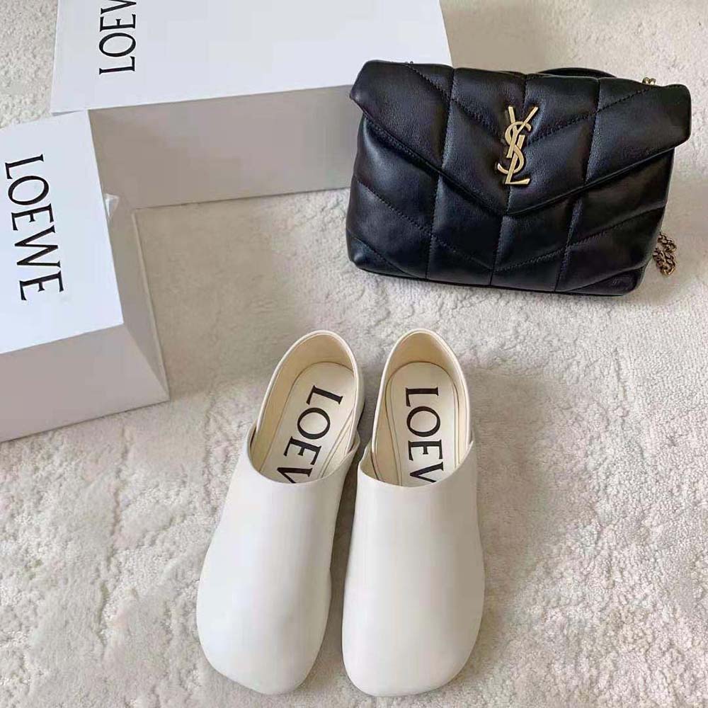 Close-up of white goatskin texture and Loewe signature detail on slipper