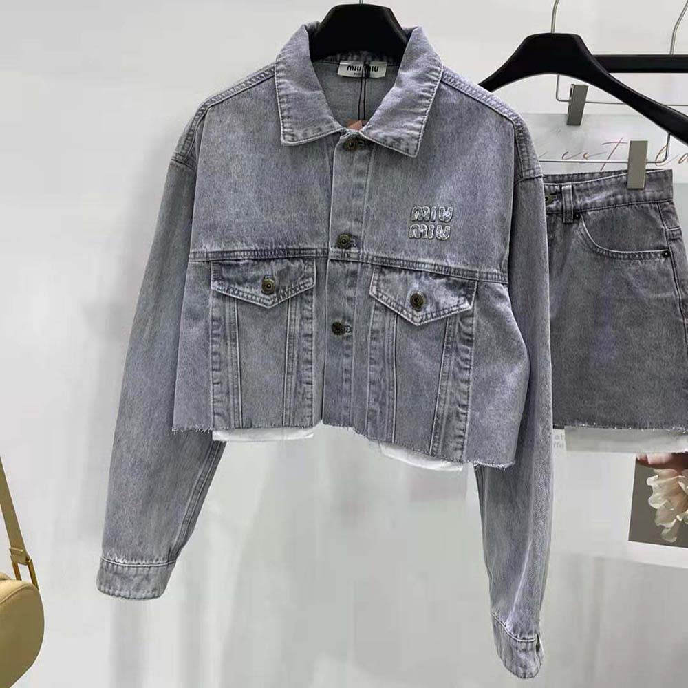 Close-up of embroidered logo detail on Miu Miu Women Denim Blouson Jacket