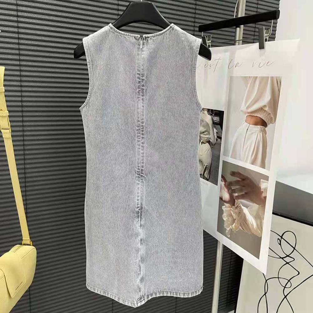 Side angle showing silhouette and snap-button closure of Miu Miu Denim Dress
