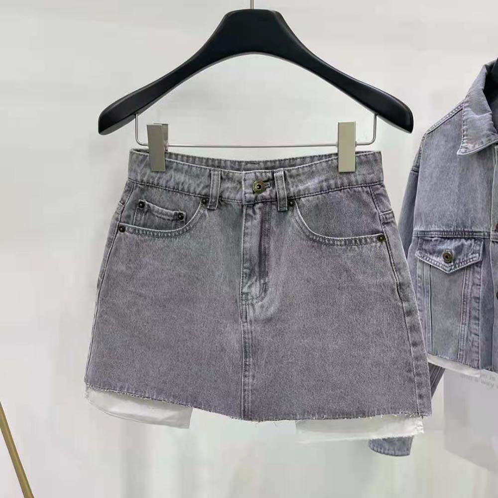 Close-up of embroidered logo detail on Miu Miu Women Denim Shorts