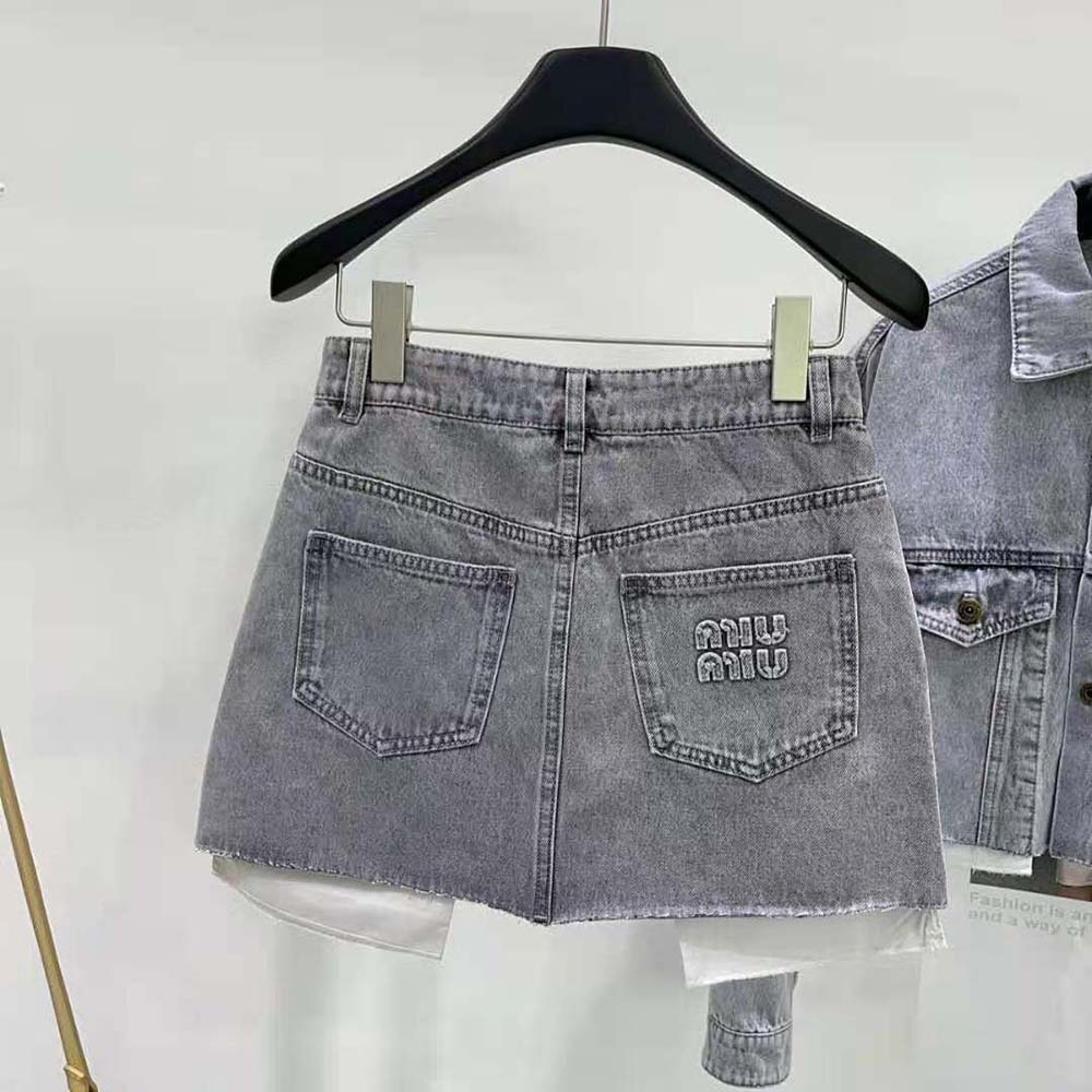 Side profile showing silhouette of Miu Miu Women Denim Shorts in silver