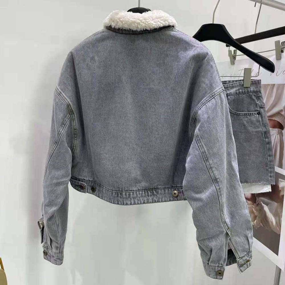 Side profile showing relaxed fit of Miu Miu Women Embroidered Denim Blouson Jacket