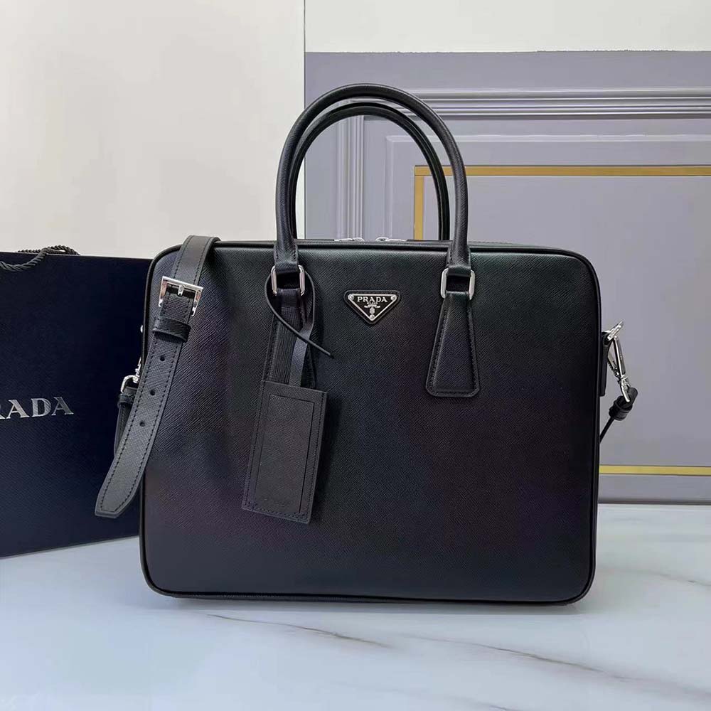 Close-up of silver Prada logo hardware on black Saffiano leather bag