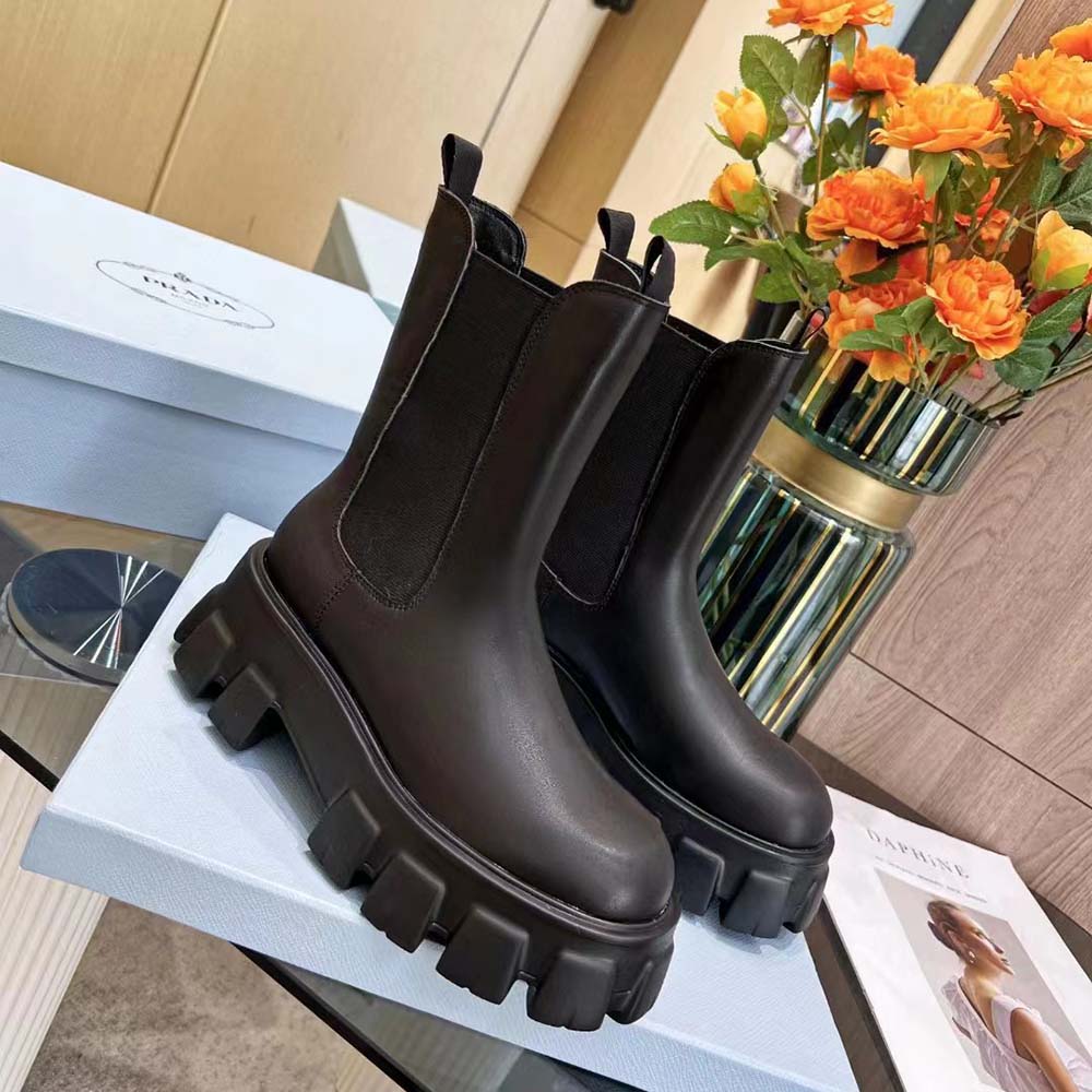 Top angle showing elastic side panel and chunky sole on Prada boots