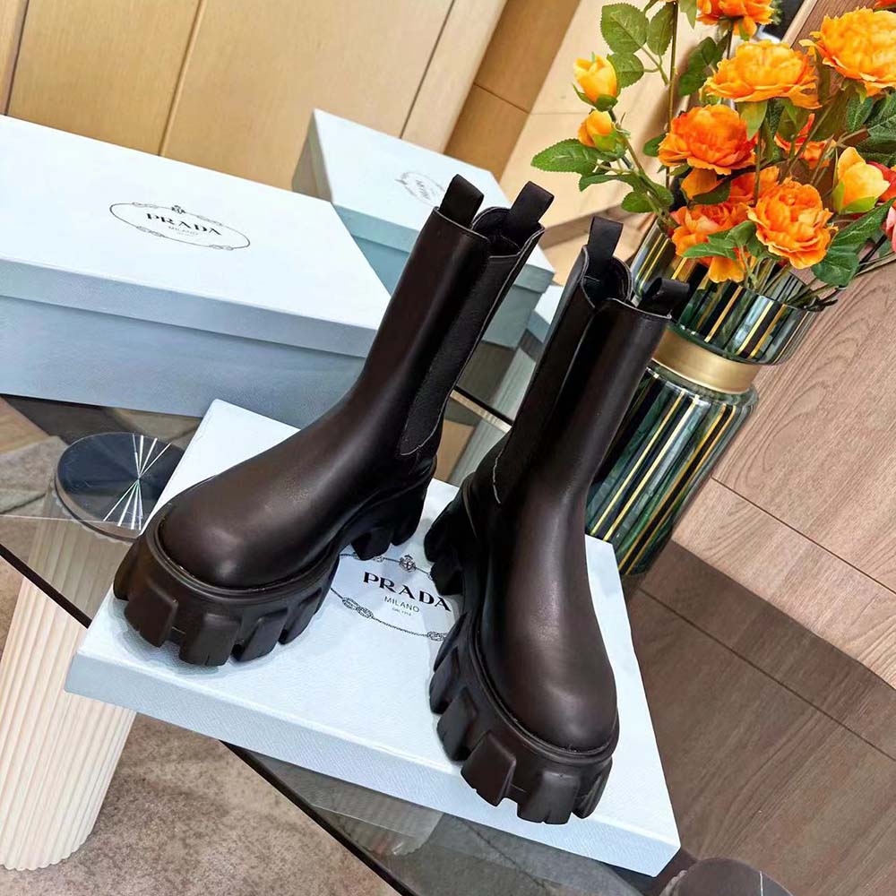 Close-up detail of brushed leather texture on Prada Monolith boots