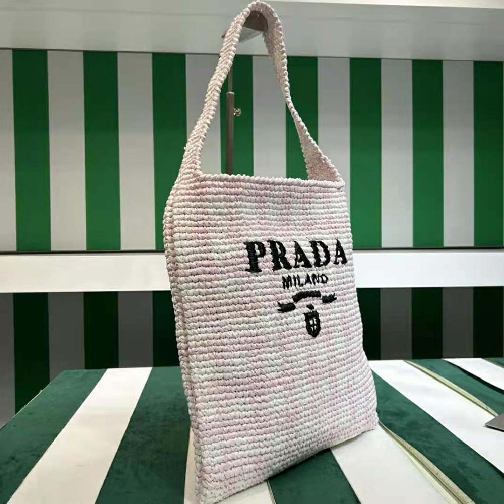 Side angle showing silver hardware on Prada Women Crochet Tote Bag Pink