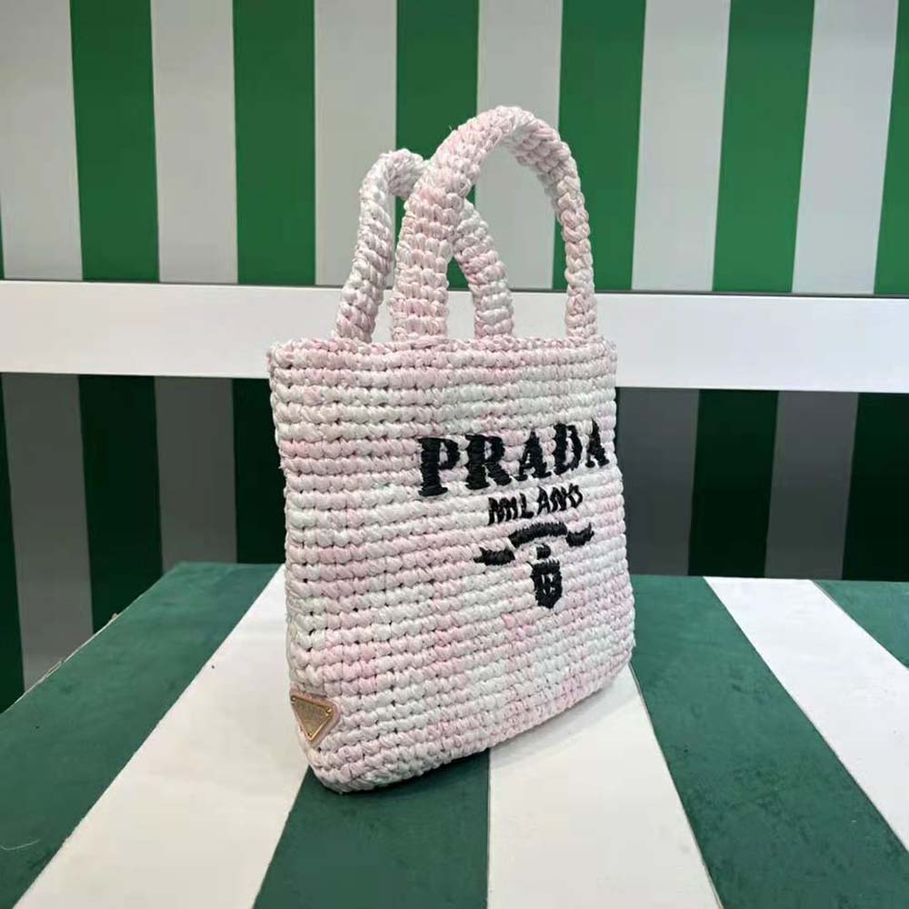 Side profile showing silver-tone hardware detail on Prada crochet tote bag
