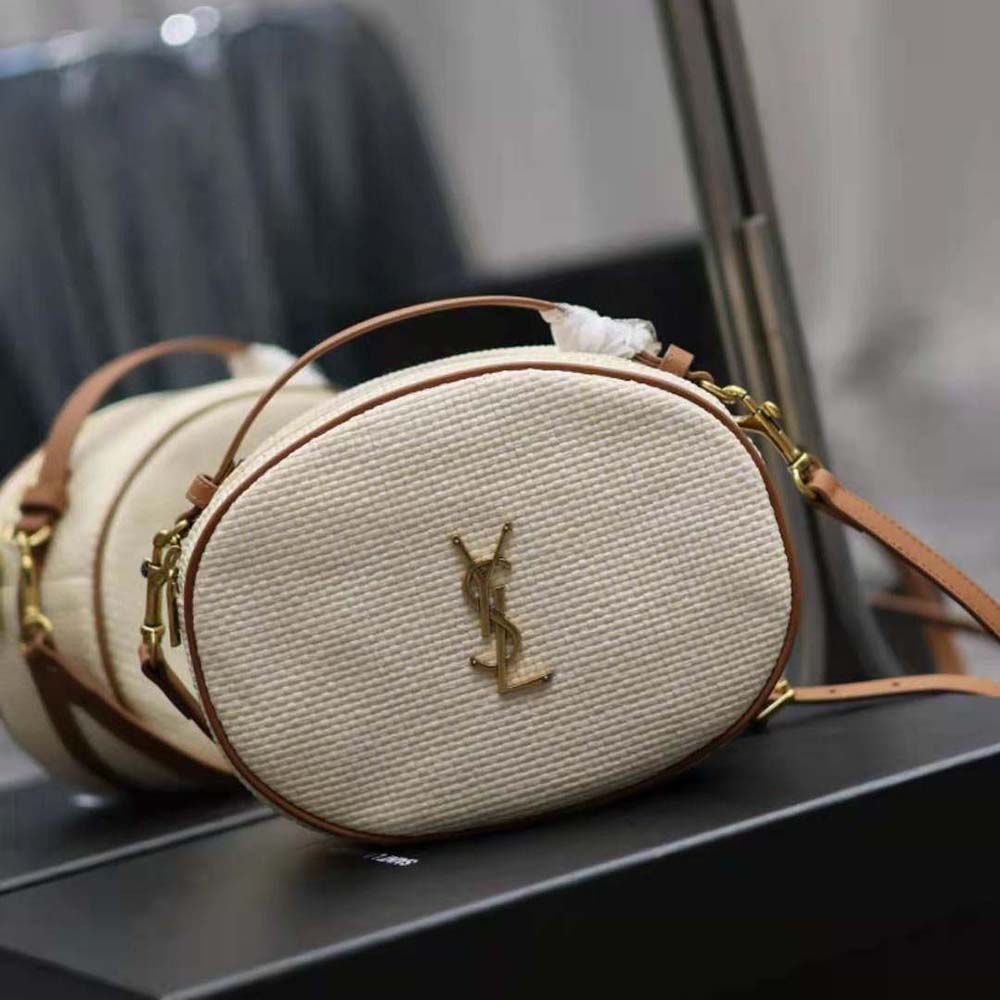Side angle showing textured raffia and leather trim on Saint Laurent bag