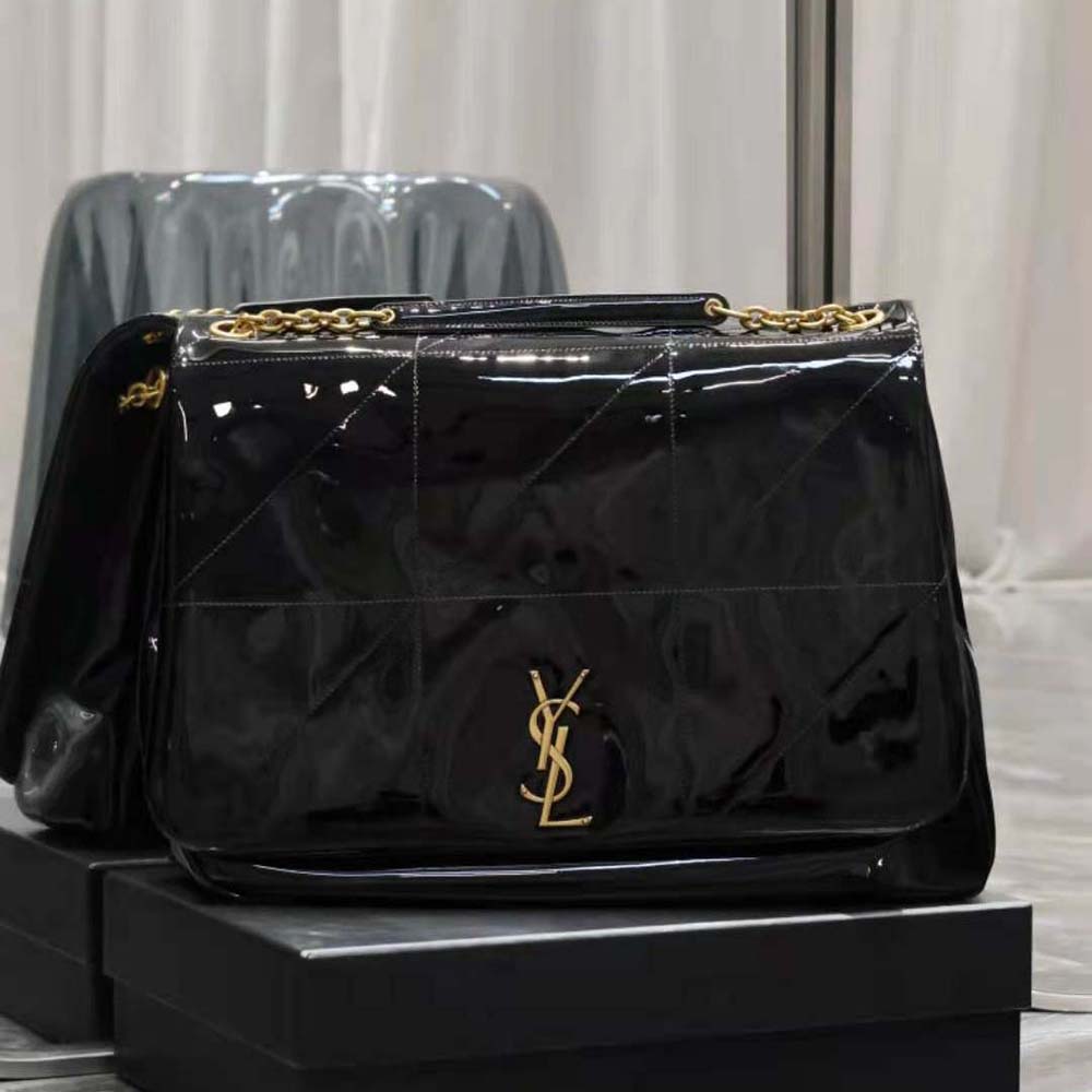 Close-up detail of glossy patent fabric and YSL gold hardware on Jamie bag